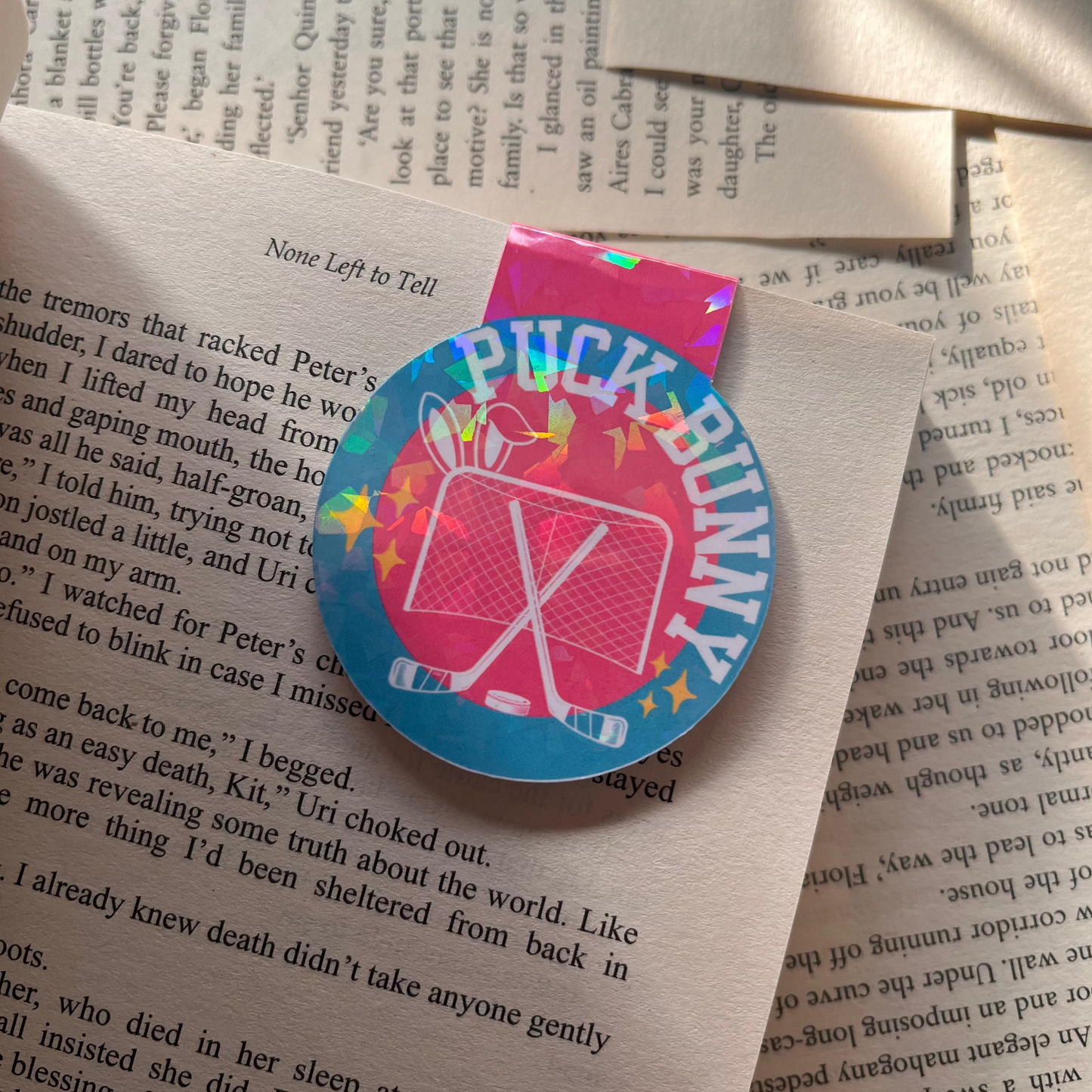 Colorful 'Puck Bunny' magnetic bookmark on a book page