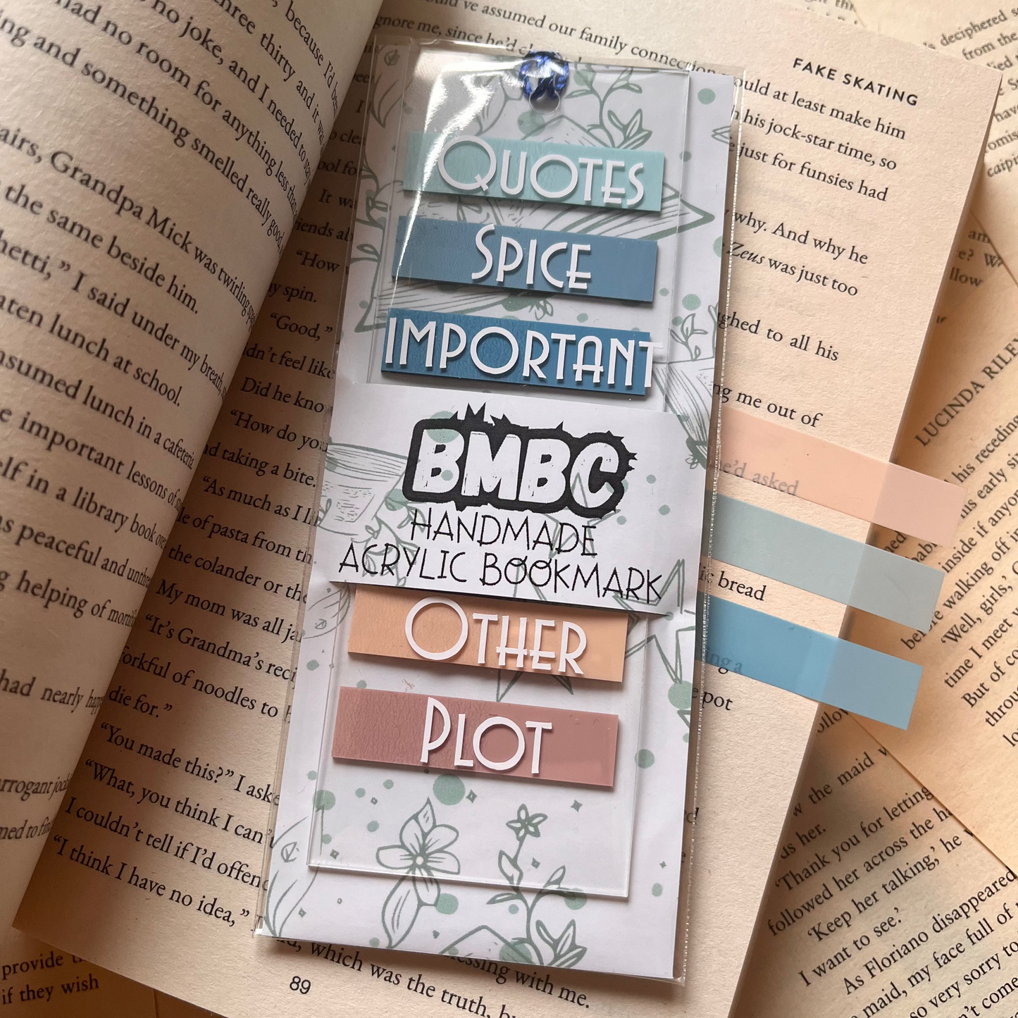 Annotation acrylic bookmark on an open book in it's packaging