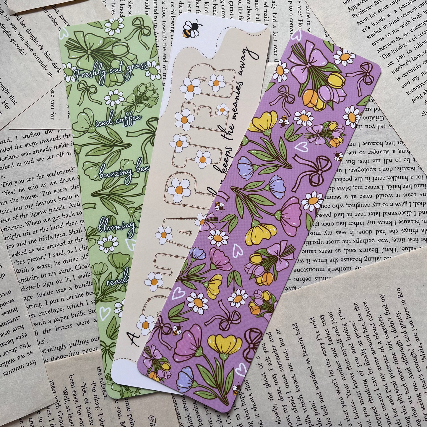 3 colourful spring vibe bookmarks lay on book pages background