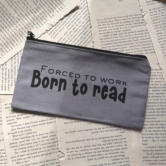 Gray pouch with 'forced to work, Born to read' text on a background of book pages