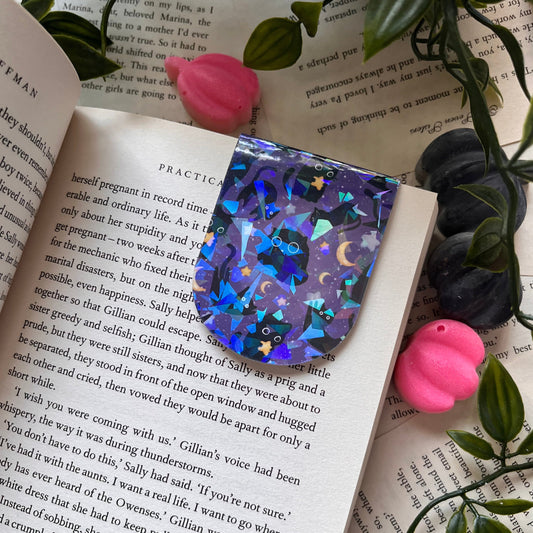 Galactic Cats magnetic bookmark with a purple cat design.