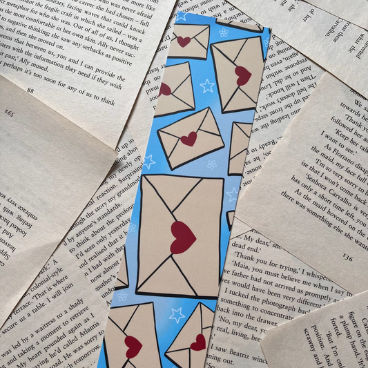 Decorative bookmarks with heart designs on a textured paper background