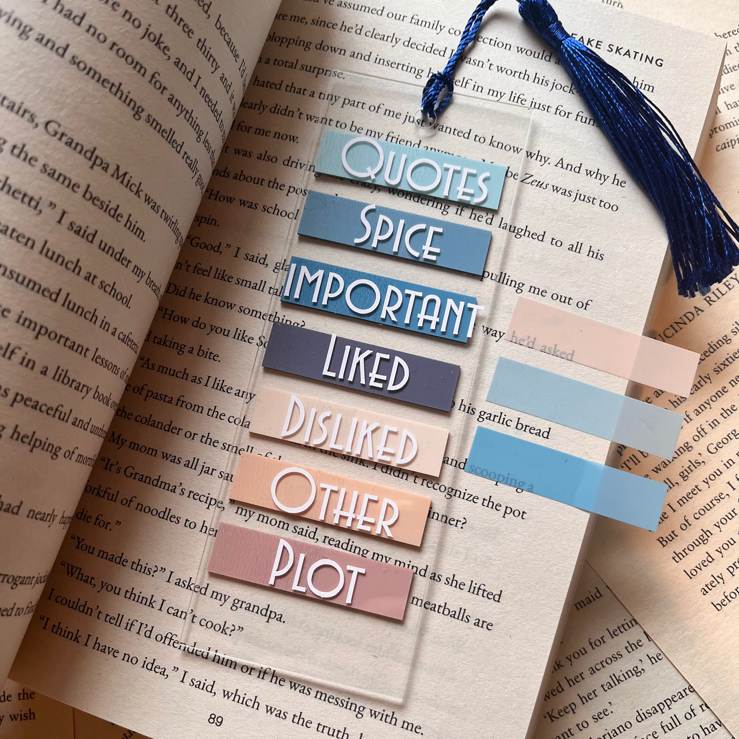 acrylic bookmark with annotation tabs on an open book