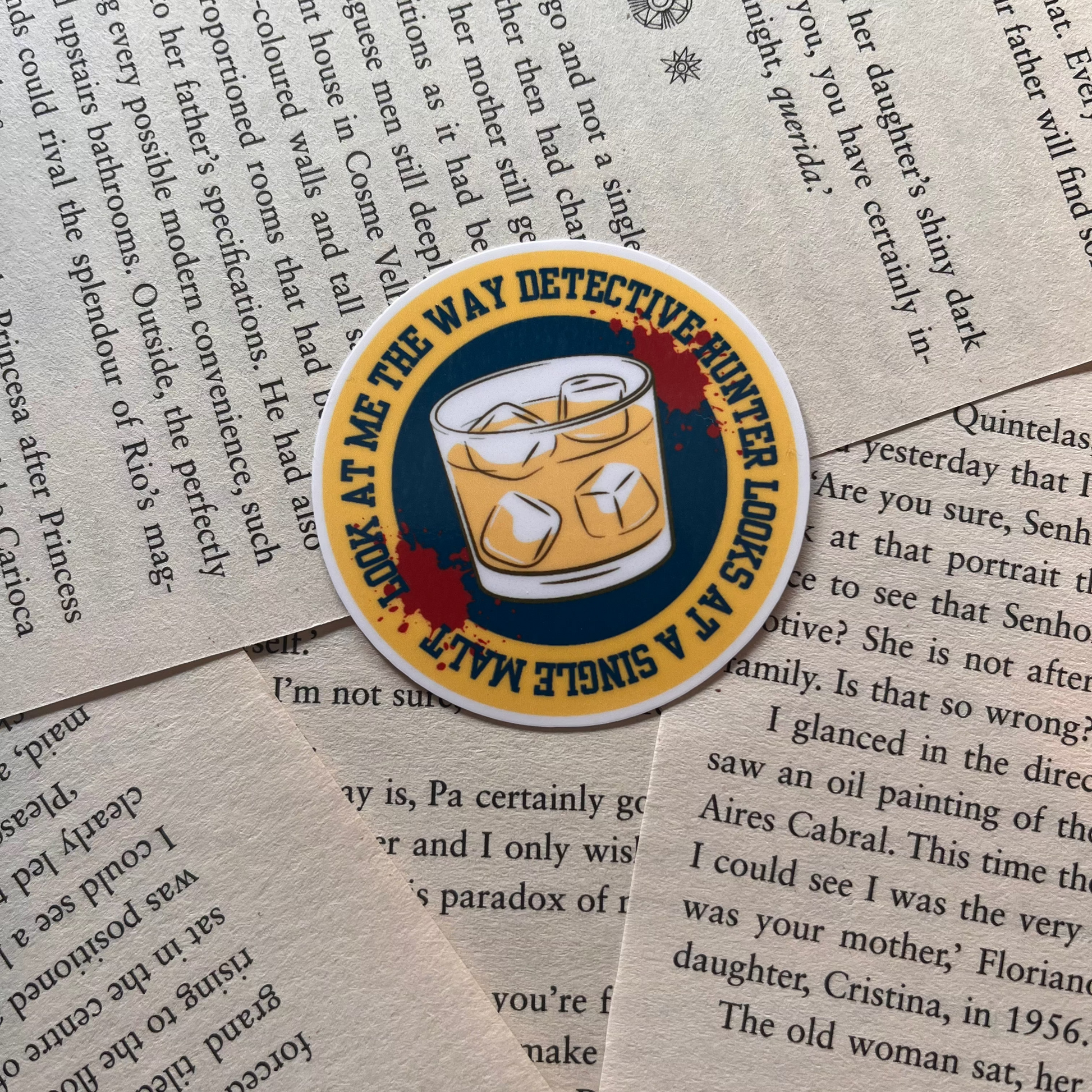 Sticker with a cocktail graphic on a book page background