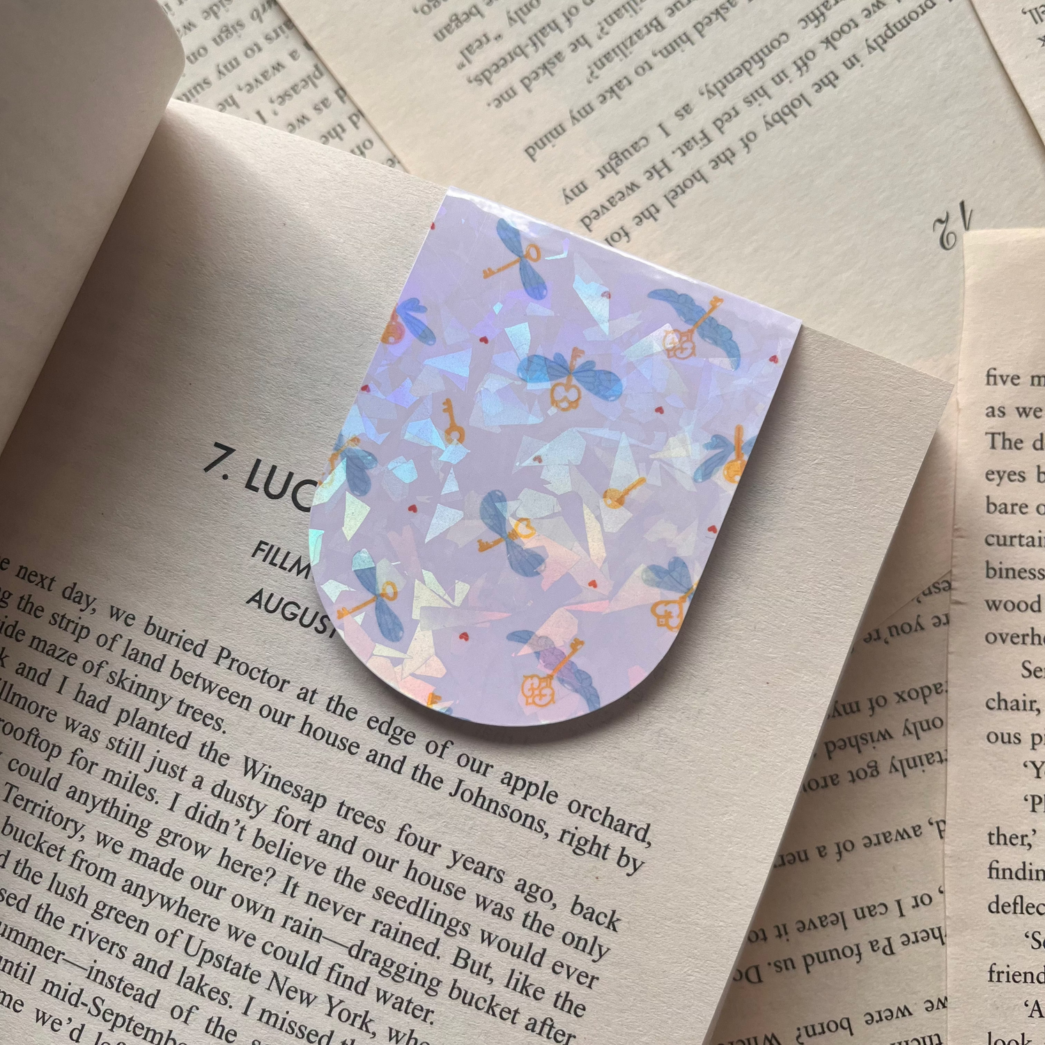 magnetic bookmark with a flying key design on a book
