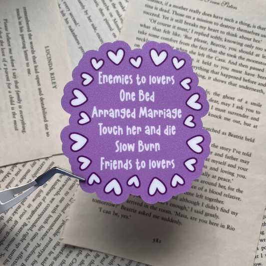 Purple glittery vinyl sticker showing different romance tropes found in books